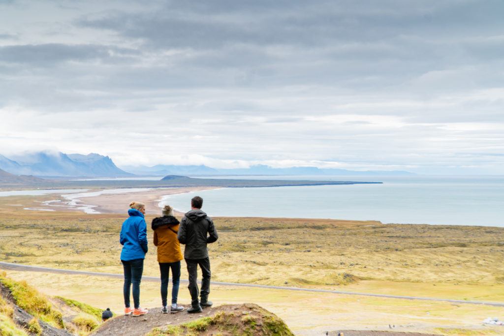 three friends overlooking landscape and water on the Snaefellsnes peninsula