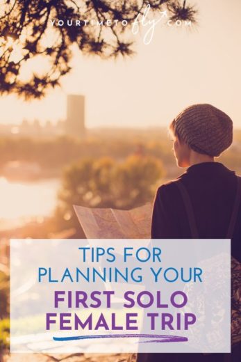 Tips for planning your first solo female trip woman traveler with map overlooking city