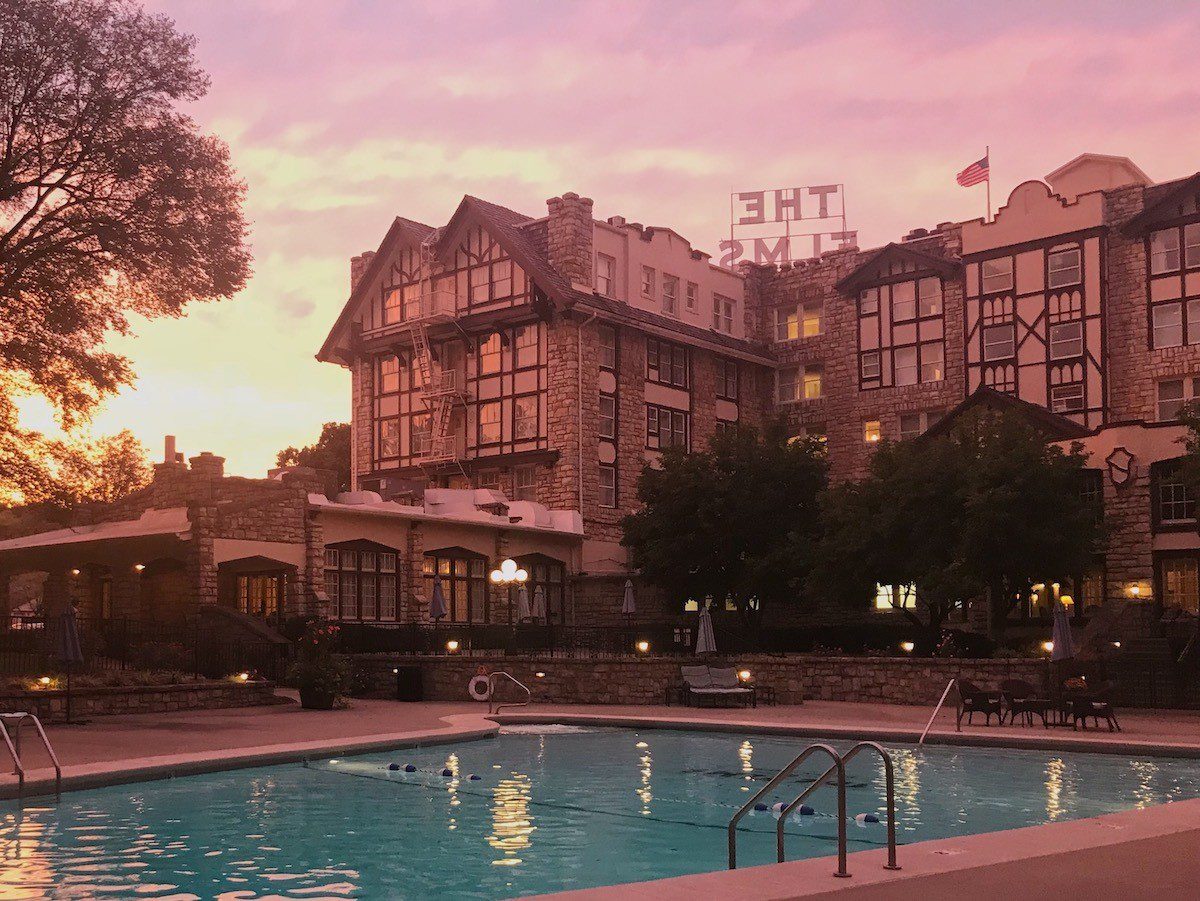 The Elms hotel and pool at sunset