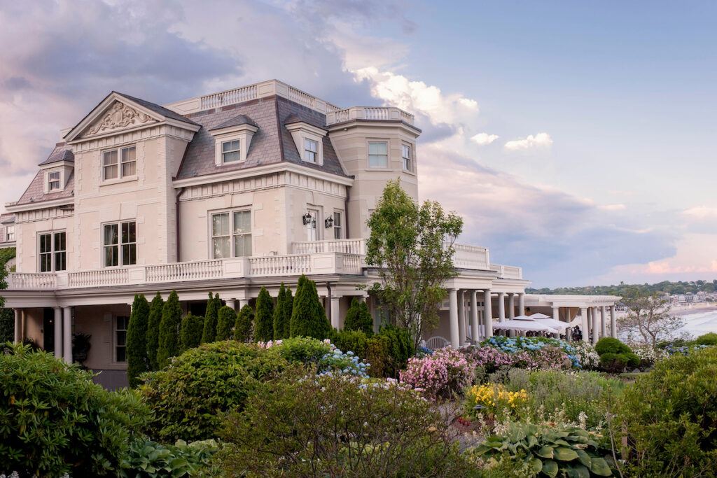 The Chanler at Cliff Walk exterior with flowering bushes out front