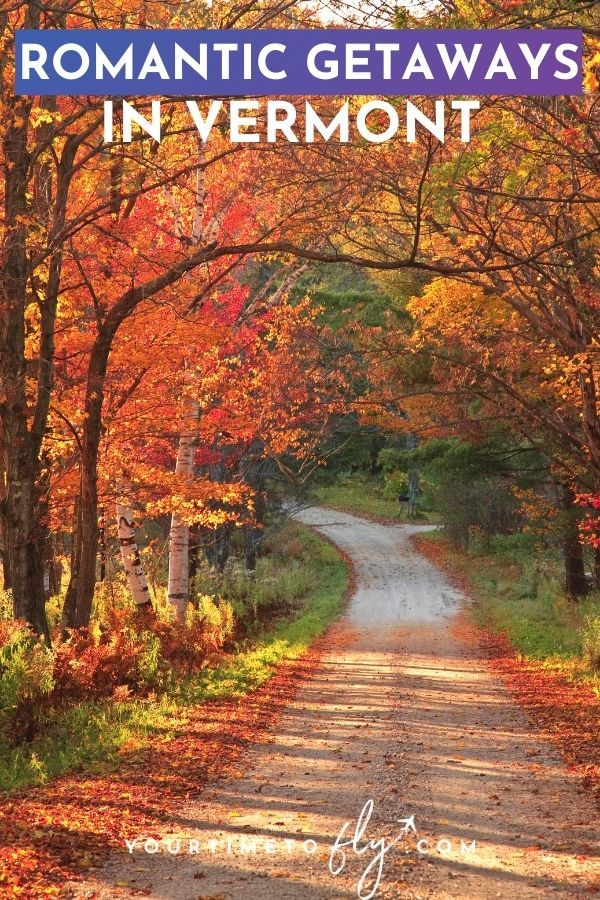Romantic getaways in Vermont road through the woods with orange fall leaves