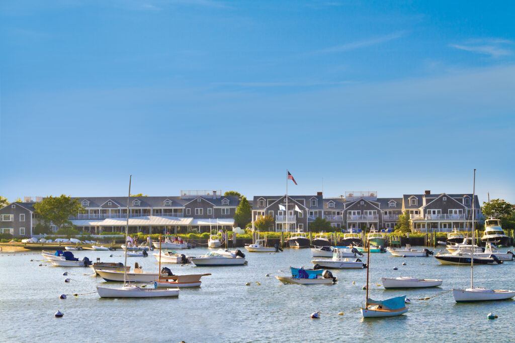 White Elephant hotel from the water with boats in the harbor