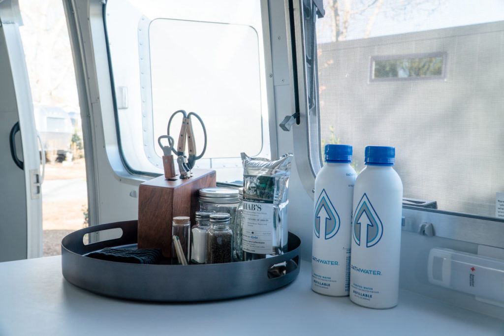 Airstream kitchen amenities and water bottles