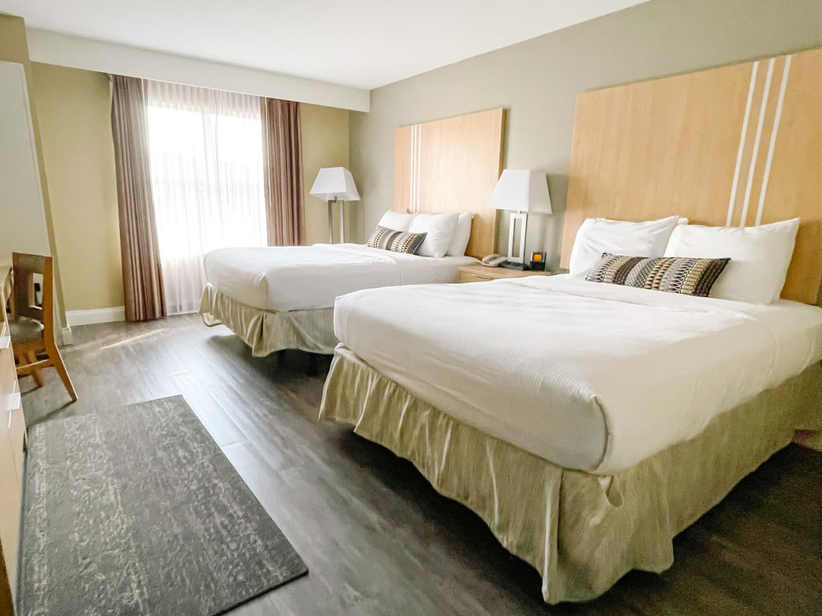 Two queen beds in bedroom at Hotel Ithaca