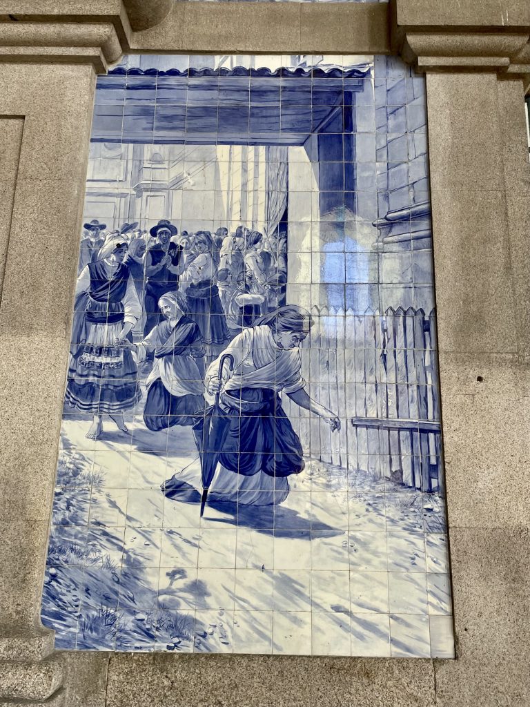 Blue and white tile murals in the Sao Bento train station in Porto