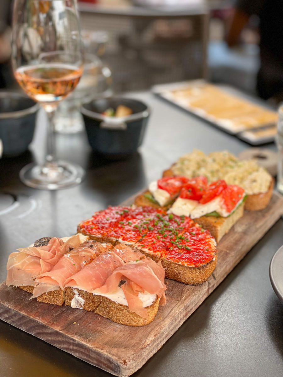 Bruschetta board and wine glass at Postino Annex in Tempe