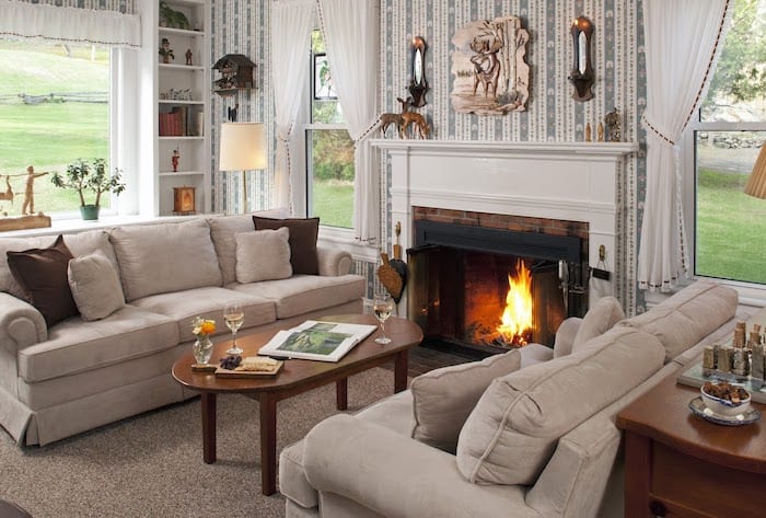 Public spaces with couches and a fireplace at the Inn on Golden Pond