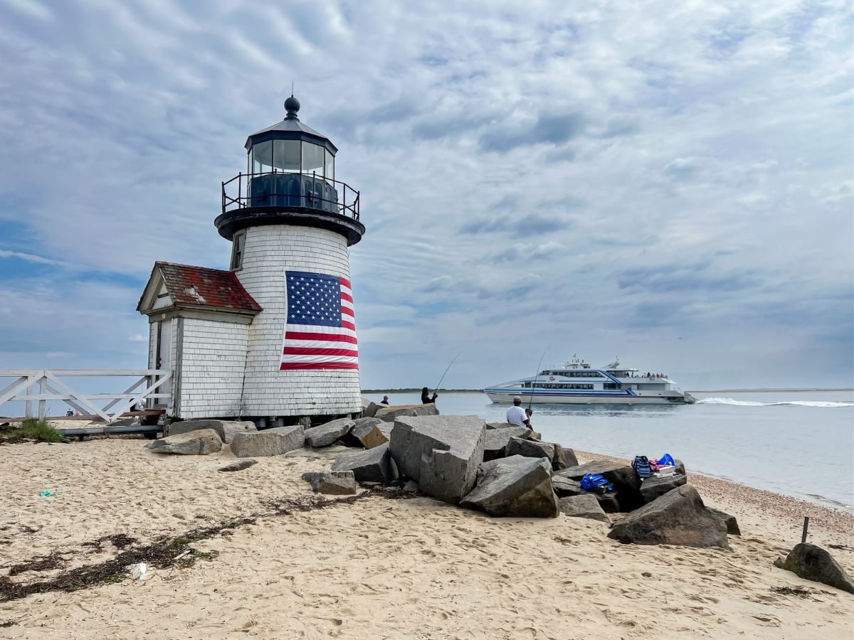 Ferry boat passing Brant Point Light on Nantucket