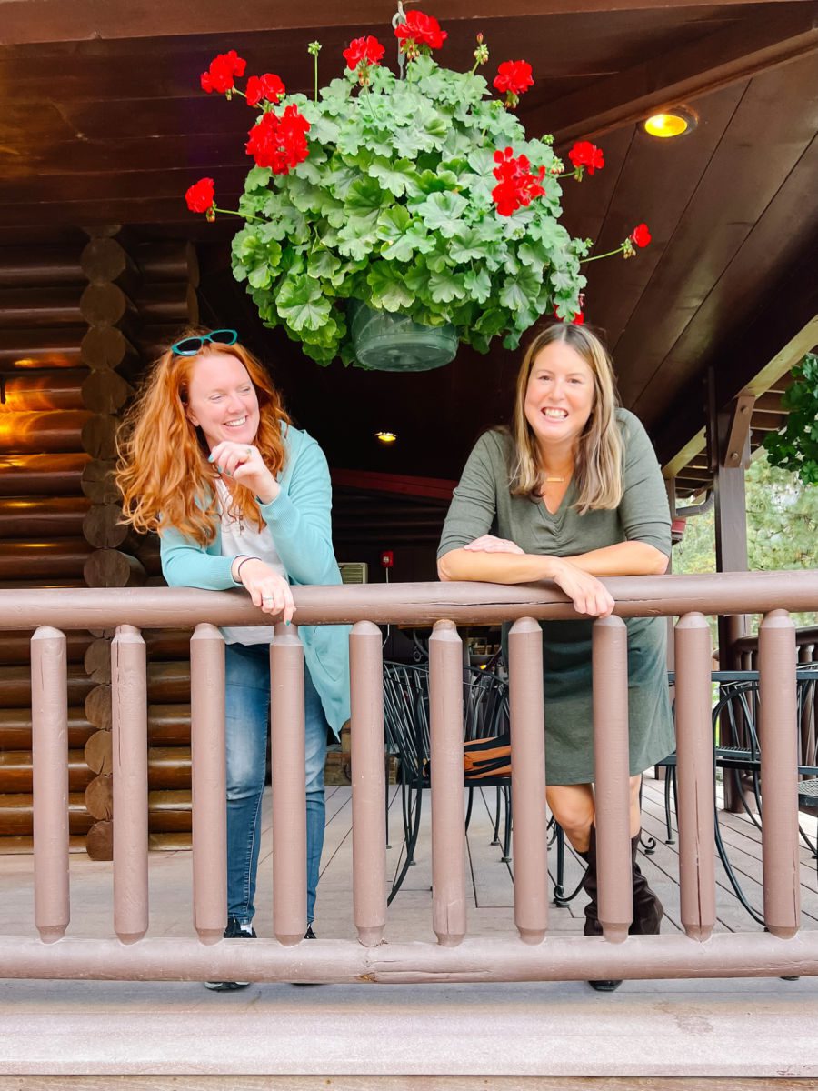 Tamara and Keryn laughing on porch at Quinn's Hot Springs