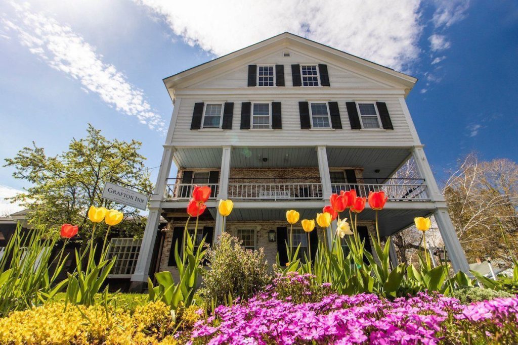 exterior of the Grafton Inn with spring tulips