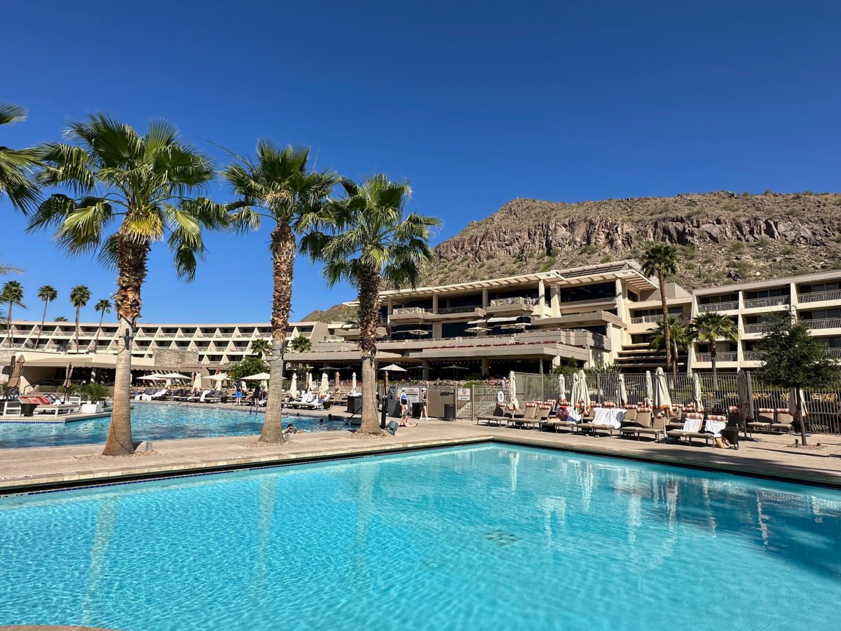 Phoenician resort pool with hotel and mountains in the background