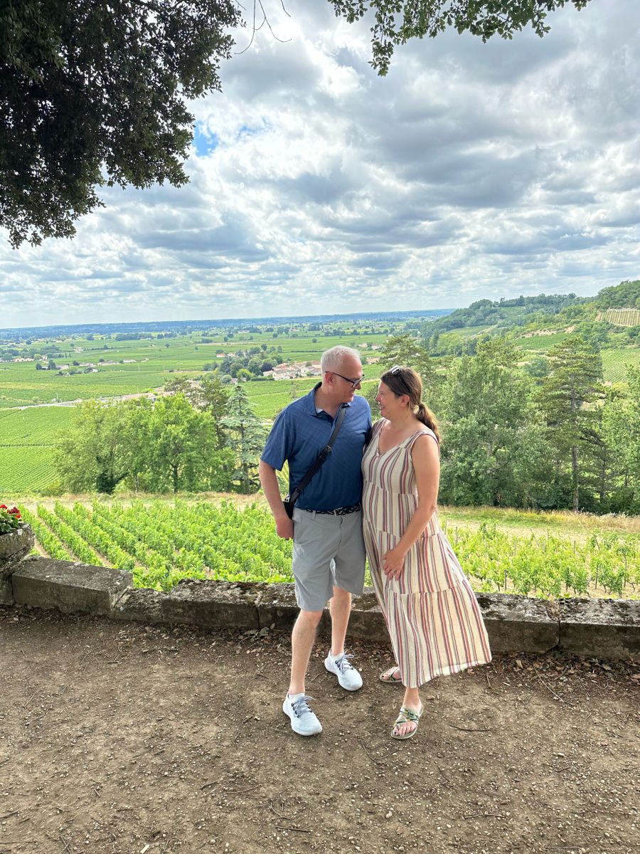 Couple in front of a vineyard at Chateau Pressac