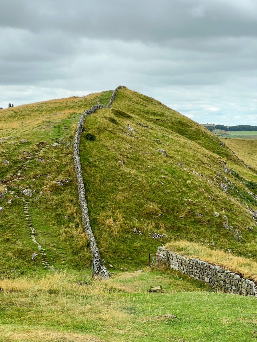 Tall hill and roman wall on Hadrian's Wall path