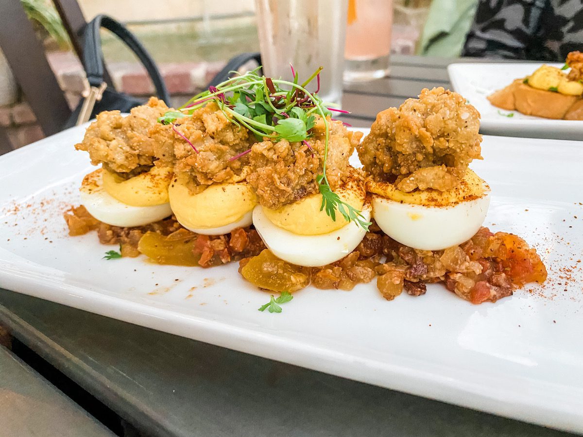 Deviled eggs with fried oysters on top 