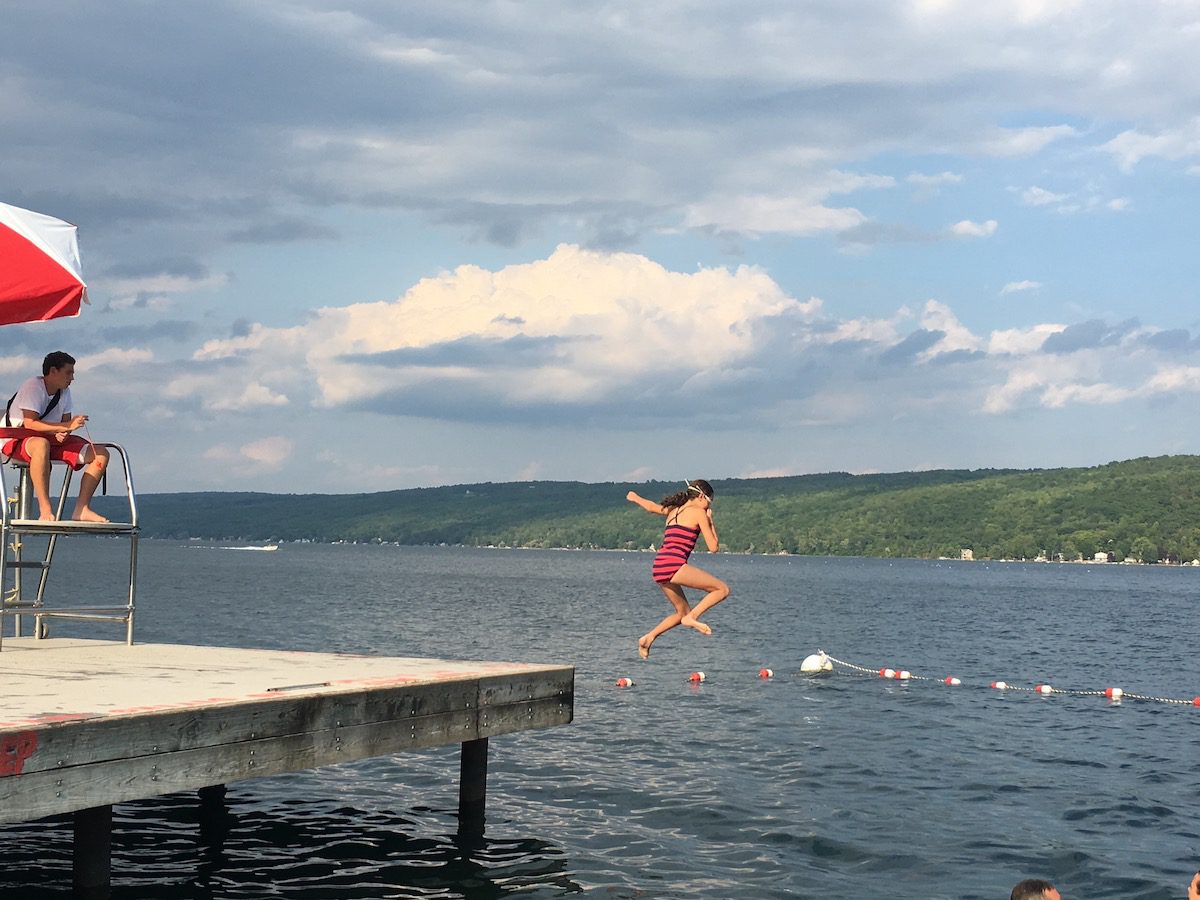 Hannah jumping from dock into Keuka Lake