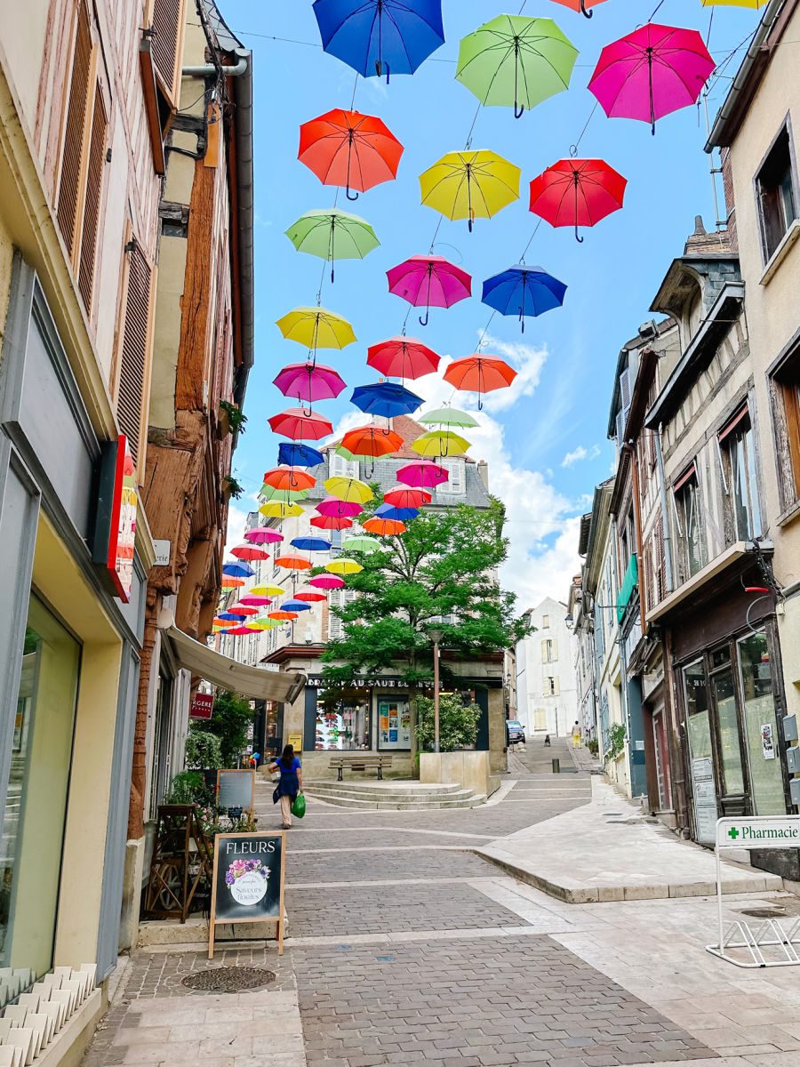 Umbrellas over street in Joigny
