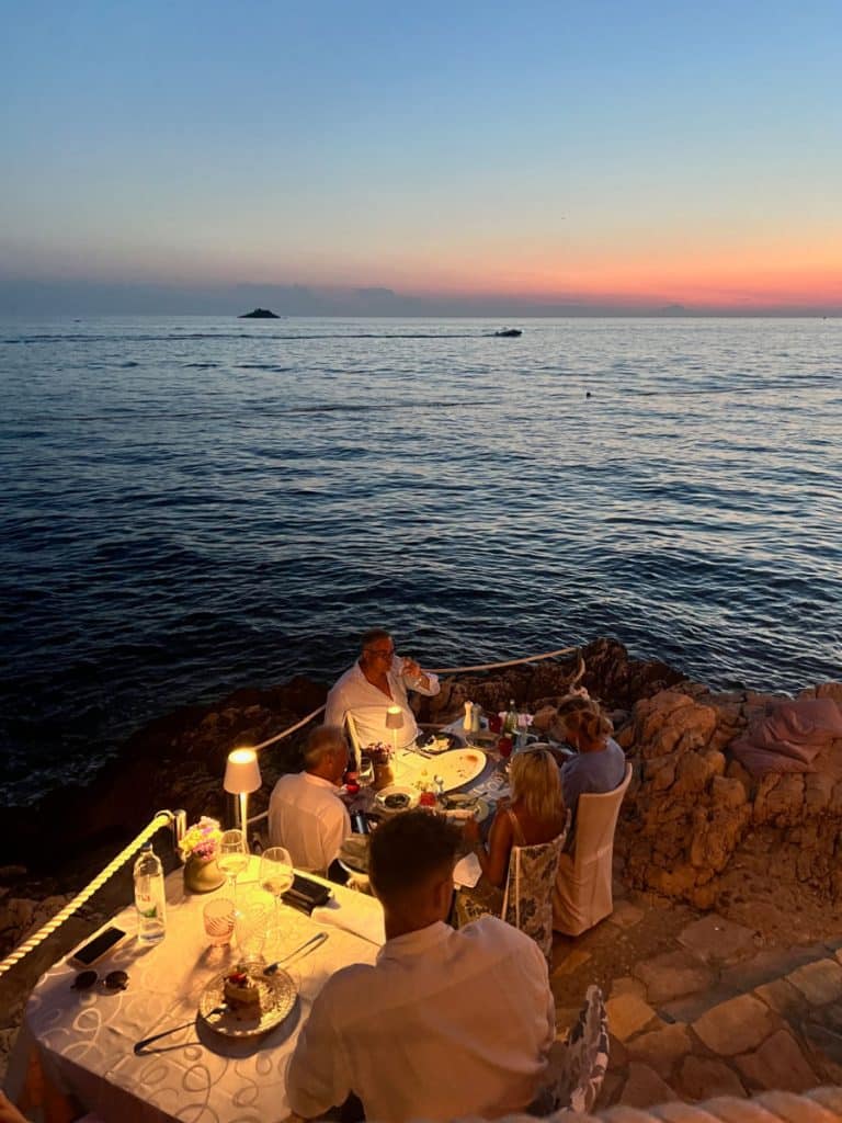 tables on rocks at Puntulina in Rovinj