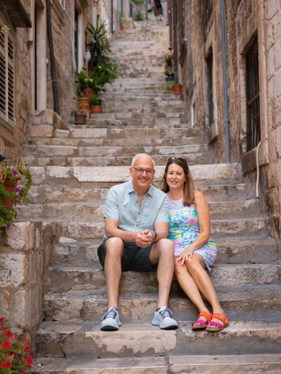 Couple sitting on steps in Dubrovnik. Image by Valentina for Flytographer.
