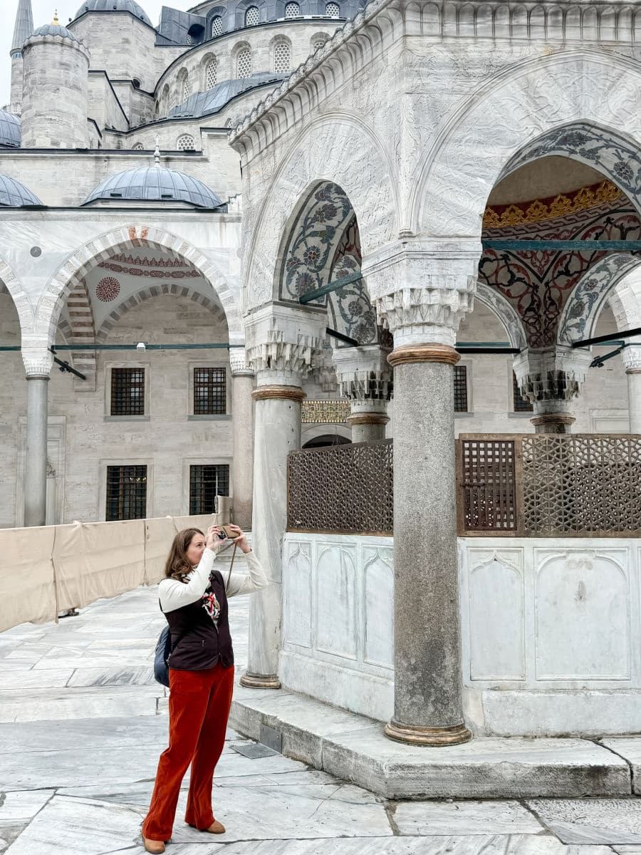 Tamara outside of the Blue Mosque in Istanbul taking a picture