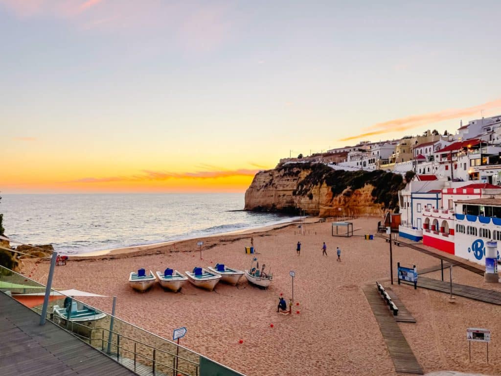 Carvoeiro Portugal beach at sunset with fishing boats